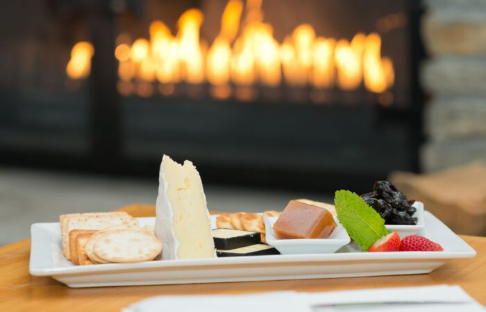 heartland hotel queenstown canapes served in front of fire place
