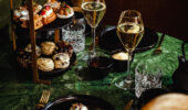 A high tea with glasses of wine at the Hotel Jerome, Aspen USA