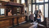 A family walking into the Hotel Jerome lobby, Aspen USA