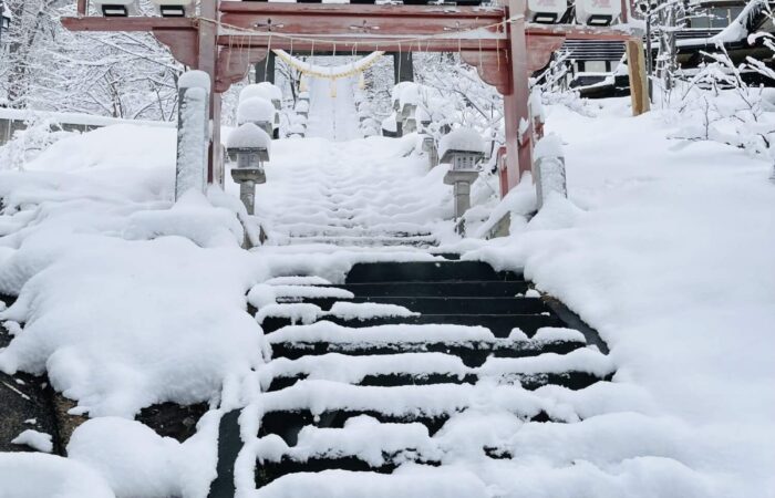 Sukawa Shrine in Zao Onsen Japan surrounded by snow