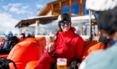 Skier enjoying the après-ski atmosphere in Méribel, France.