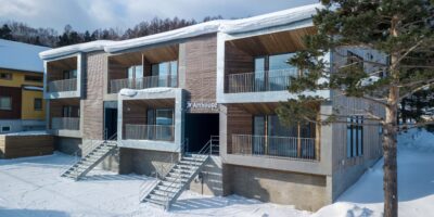 Exterior of Arthouse Apartments covered in snow in Furano Japan