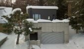 Exterior of Shochikubai accommodation covered in snow in Furano Japan