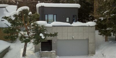 Exterior of Shochikubai accommodation covered in snow in Furano Japan