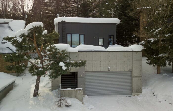 Exterior of Shochikubai accommodation covered in snow in Furano Japan