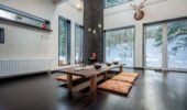 Traditional Japanese dining room with low table and floor cushions at Shochikubai accommodation Furano