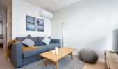 Sofa seating in the lounge room at Arthouse Apartments Furano