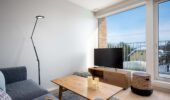 Lounge room with television at Arthouse Apartments accommodation Furano