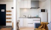Compact kitchenette at Arthouse Apartments in Furano Japan