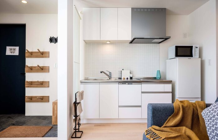 Compact kitchenette at Arthouse Apartments in Furano Japan