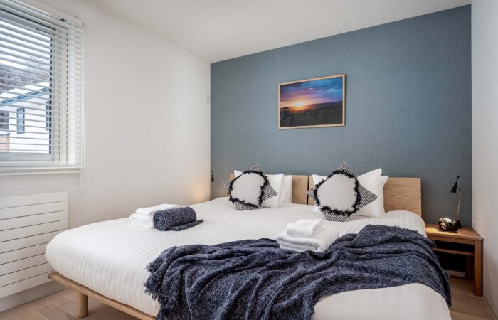 Modern bedroom at Arthouse Apartments accommodation in Furano Japan