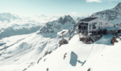 Luxury St. Moritz accommodation with panoramic views of snow-covered mountains in the Swiss Alps.