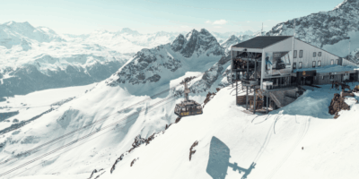 Luxury St. Moritz accommodation with panoramic views of snow-covered mountains in the Swiss Alps.