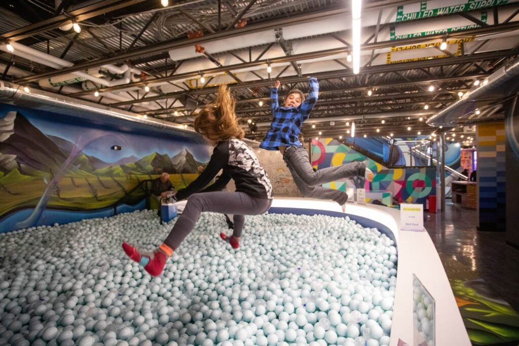 Children playing in a ball pit at The Collective Snowmass