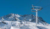 Snow tubing down a snow covered mountain at Val Thorens France