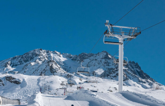 Snow tubing down a snow covered mountain at Val Thorens France