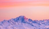 Sun rise over the snow covered mountains from Val Thorens France