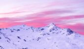 Sun rise over the snow covered mountains from Val Thorens France