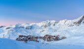 A distance aerial view of Val Thorens France amongst snow