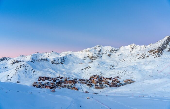 A distance aerial view of Val Thorens France amongst snow