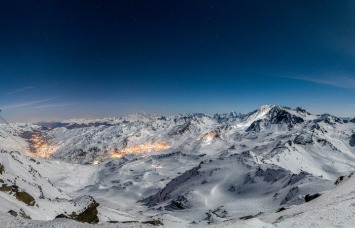 A night time view of Val Thorens amongst snow covered alps in France