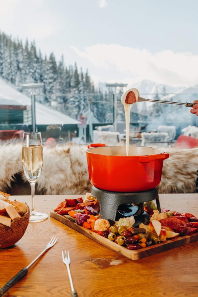 Fondue and wine table setting with mountain views at Cloud 9 Aspen
