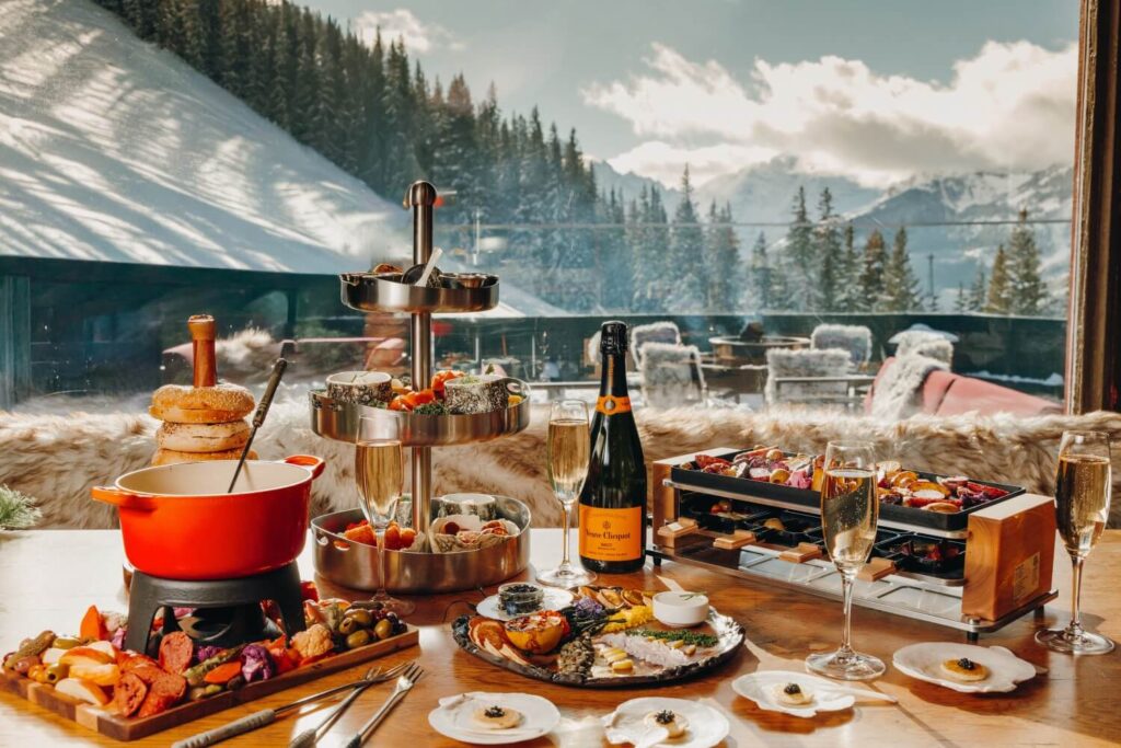 Cozy apres ski dining feast on table at Cloud 9 Alpine Bistrot Aspen