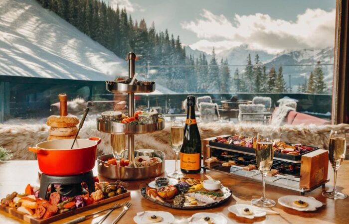 Cozy apres ski dining feast on table at Cloud 9 Alpine Bistrot Aspen