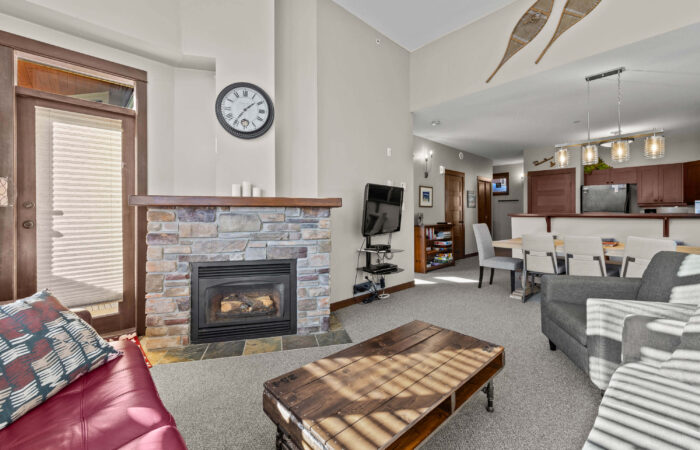 Living room with fire place at Stone's Throw accommodation Sun Peaks