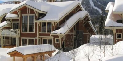 Outside view of snow covered Stone's Throw accommodation Sun Peaks in the winter