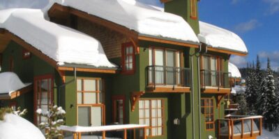 Outside view of snow covered Trail's Edge accommodation at Sun Peaks