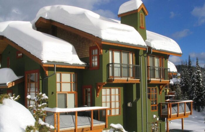 Outside view of snow covered Trail's Edge accommodation at Sun Peaks