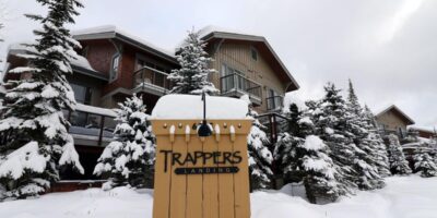 Outside view of snow covered Trapper's Landing accommodation at Sun Peaks