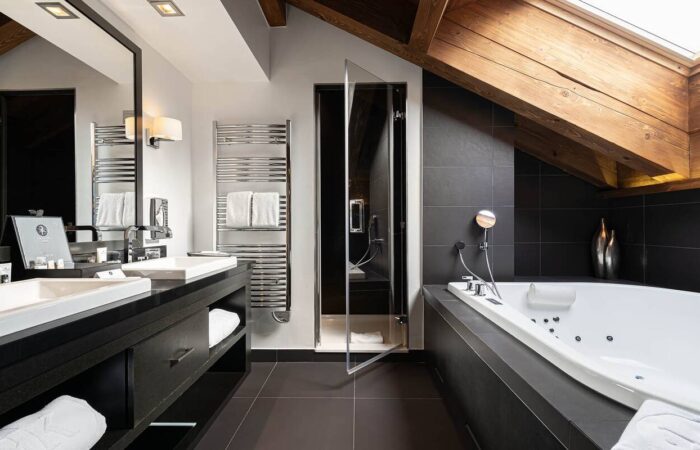 The bathroom of a studio room at Hotel Le Kaila, Meribel France