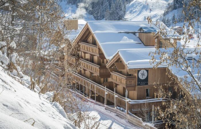 Exterior shot of the Hotel Le Kaila covered in snow