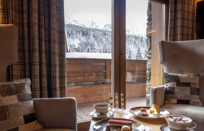Hotel room at Hotel Le Kaila Meribel France showing a view of snow covered mountains