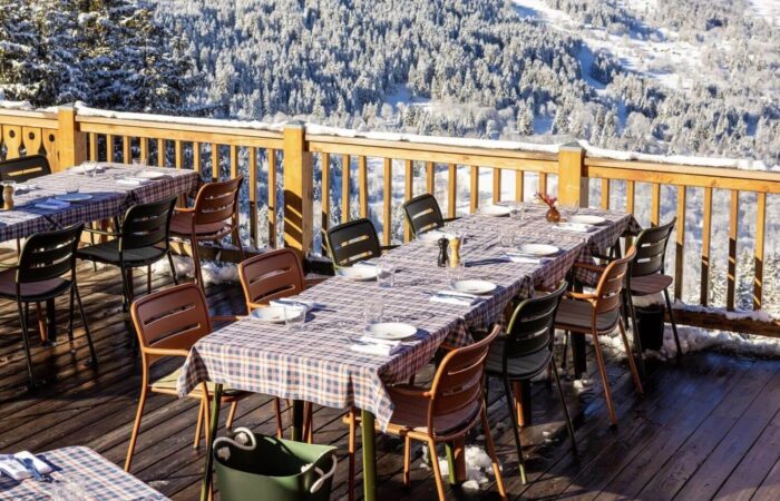 Outisde balcony dining a the Hotel Le Coucou restaurant Meribel France