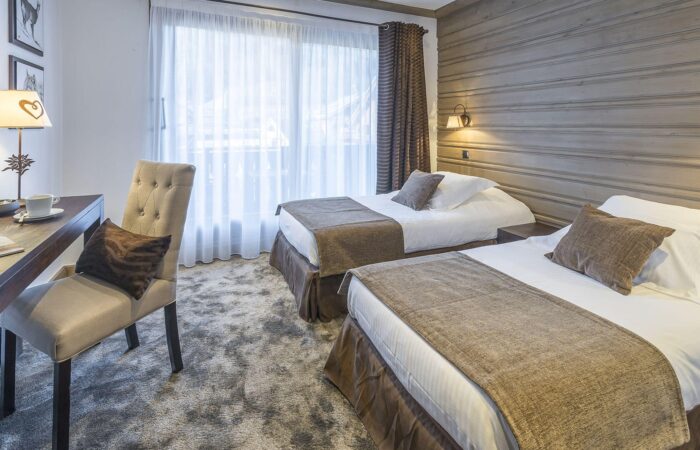 Bedroom showing 2 beds at Florian Salle restaurant at La Chaudanne Hotel & Spa Meribel France