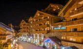 A night time shot of the exterior of Hotel Le Kaila Meribel France