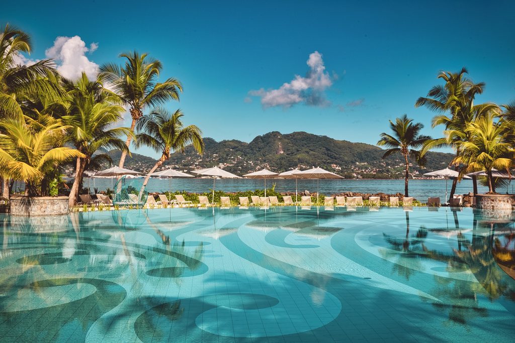 Club Med resort pool looking with view out towards the ocean