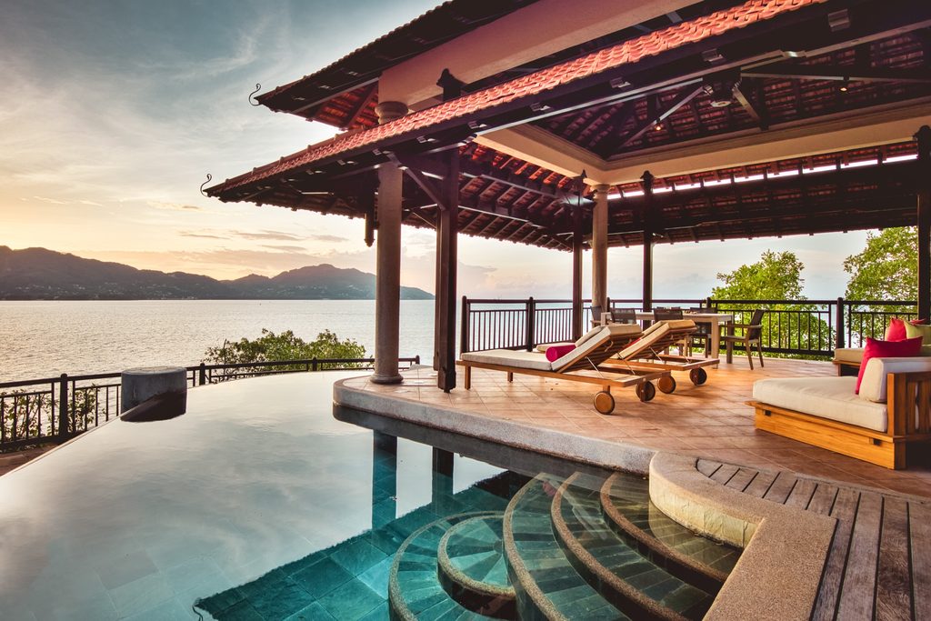 Club Med Seychelles sunlounges under pavilion by the pool