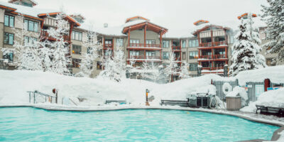 The Village Lodge Mammoth exterior view with outdoor swimming pool