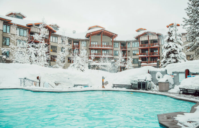 The Village Lodge Mammoth exterior view with outdoor swimming pool