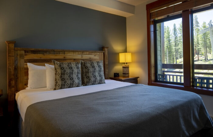 Bedroom view with a large bed at The Village Lodge Mammoth