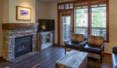 Living area with fireplace in room at The Village Lodge Mammoth