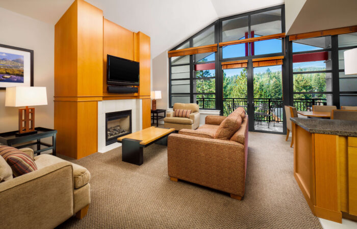 A living area with fireplace at Westin Monache Mammoth