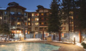 External night view by the pool of The Village Lodge Mammoth