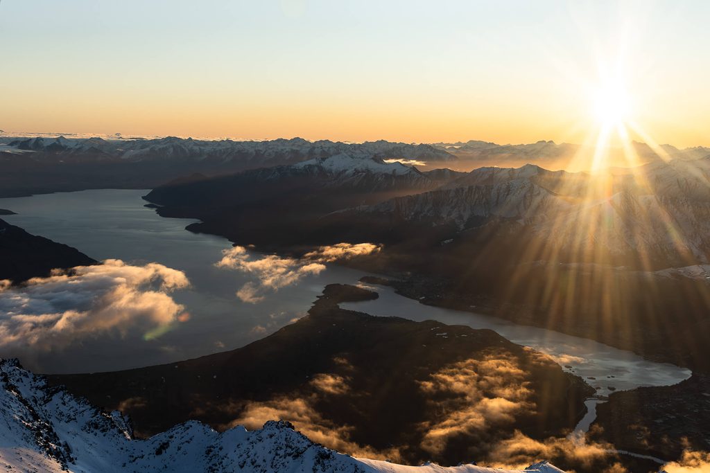 An aerial view of Milford Sound at sunset