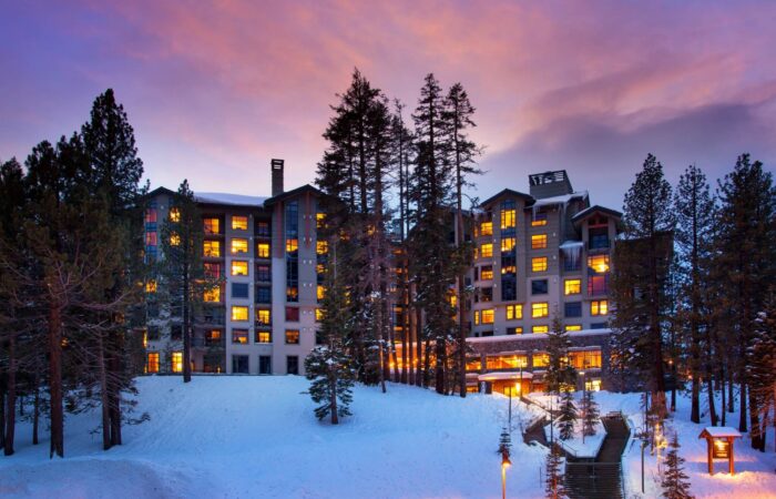 An exterior view of the Westin Monache Mammoth in winter at sunset