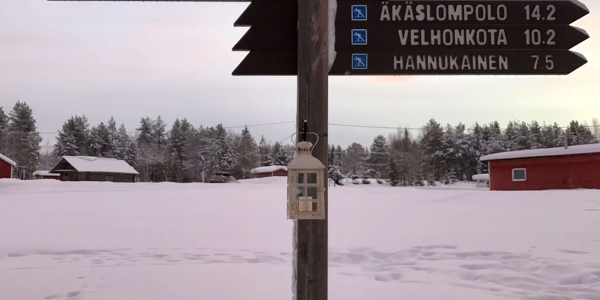 North Pole sign in Lapland surrounded by snow